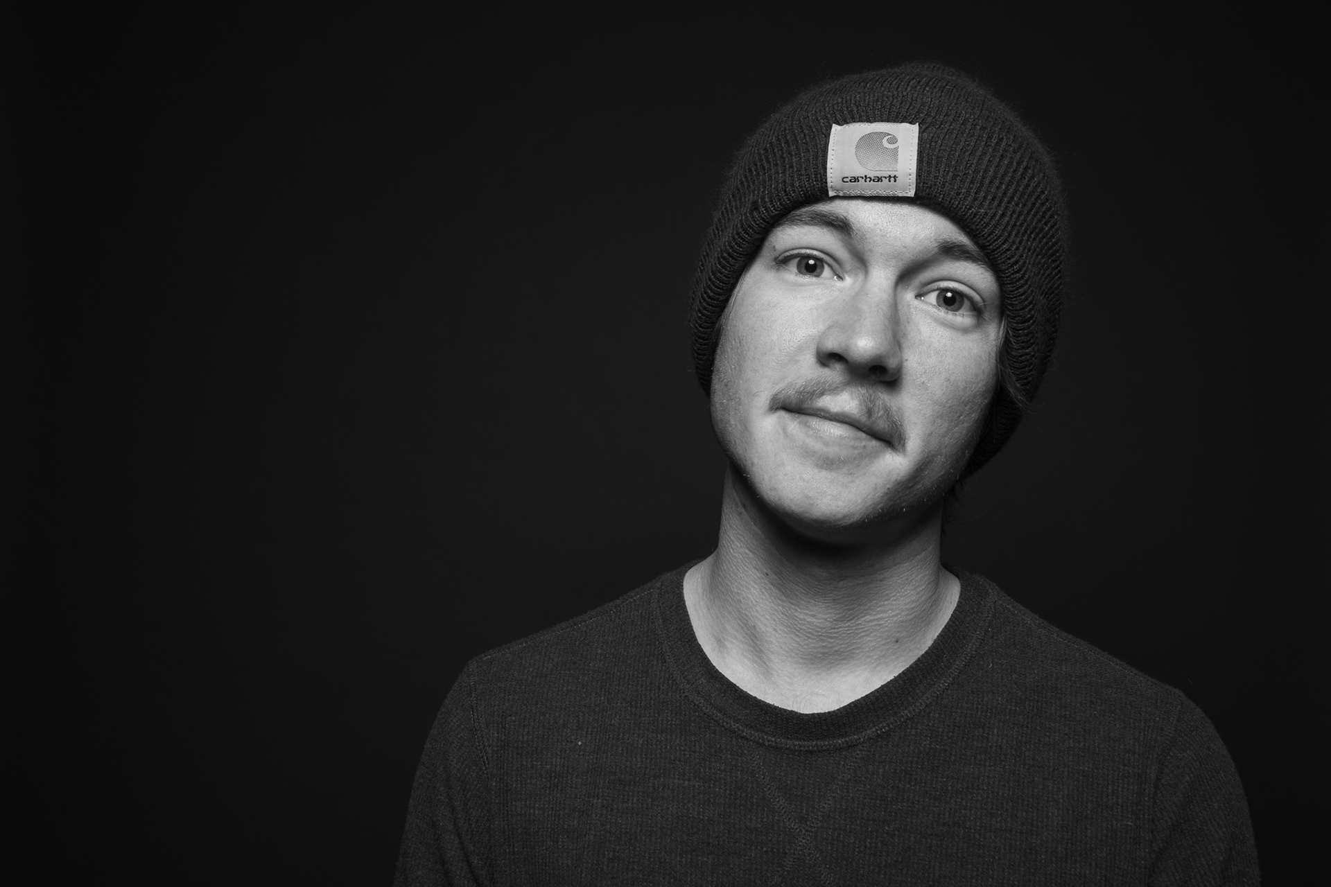 Portrait of Drew Kazanis in a Carhartt beanie